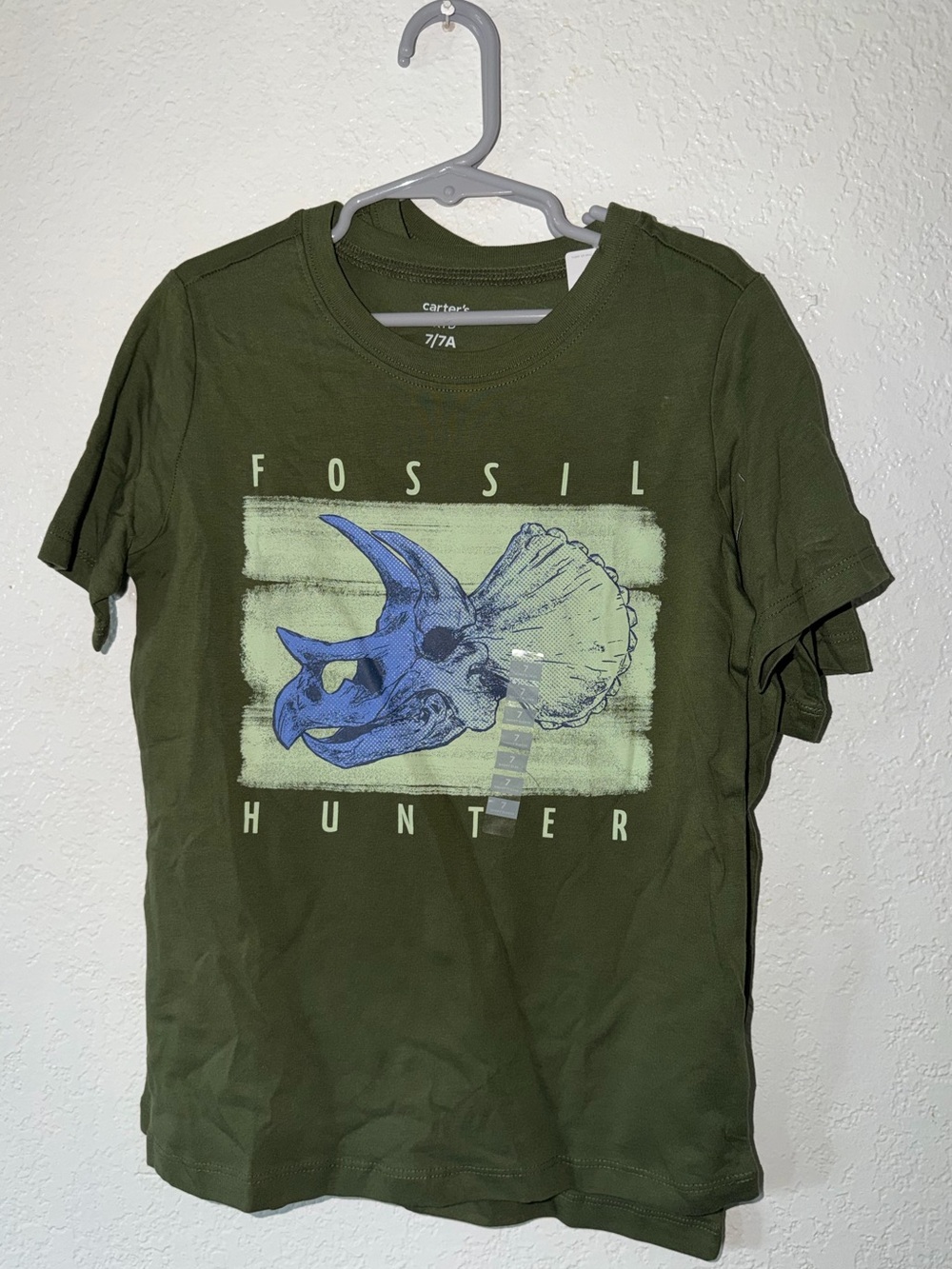 Fossil Olive Green Tee with Blue Dinosaur Skull Graphic